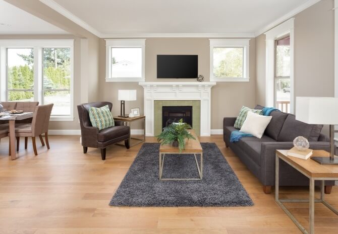 wide plank hardwood flooring in an open concept living dining area